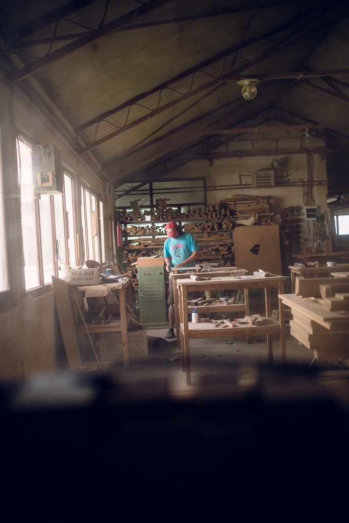 Inside the furniture workshop, pieces taking shape on the workbenches